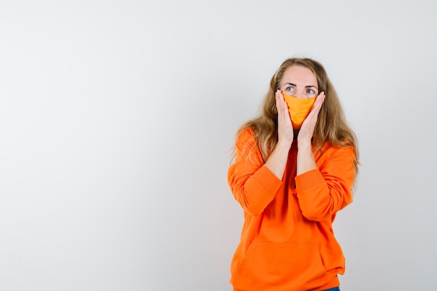 Expressive young woman posing in the studio