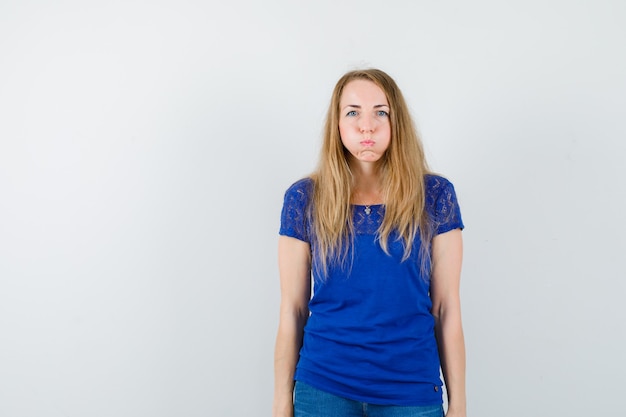 Expressive young woman posing in the studio