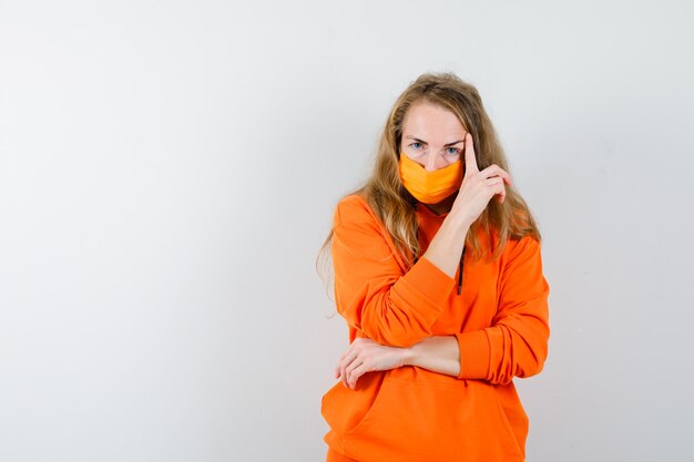 Expressive young woman posing in the studio