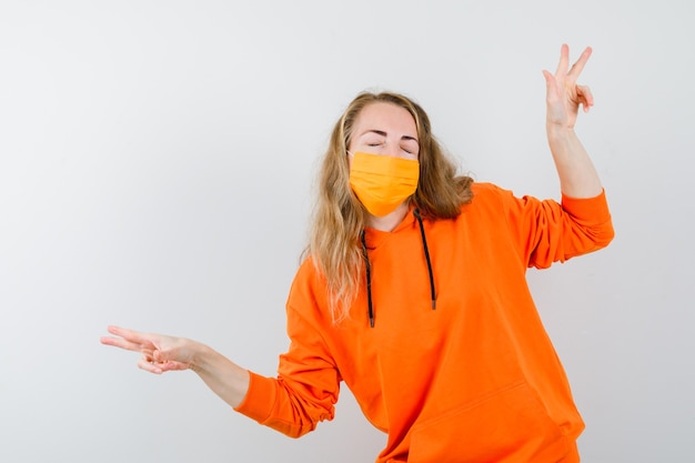 Expressive young woman posing in the studio