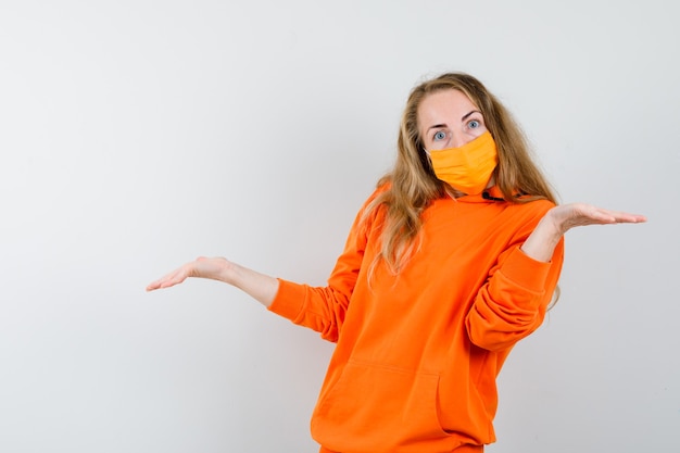 Expressive young woman posing in the studio