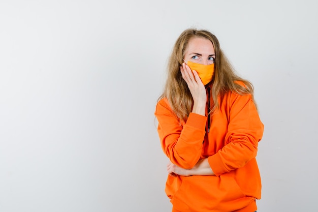 Expressive young woman posing in the studio