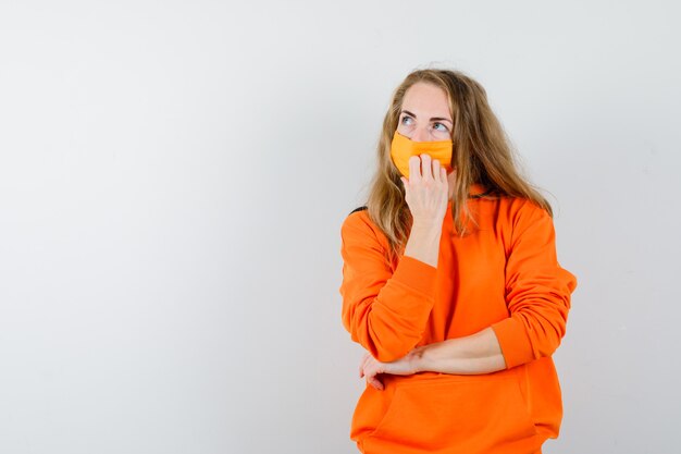 Expressive young woman posing in the studio