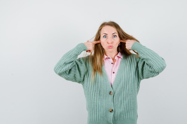 Expressive young woman posing in the studio