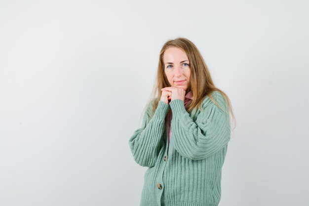 Expressive young woman posing in the studio