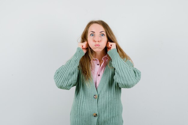 Expressive young woman posing in the studio