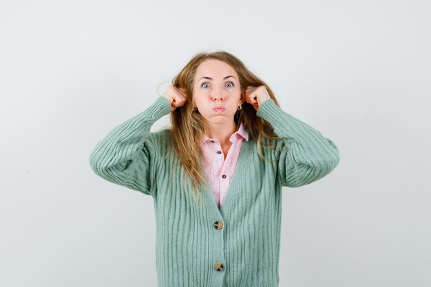 Expressive young woman posing in the studio