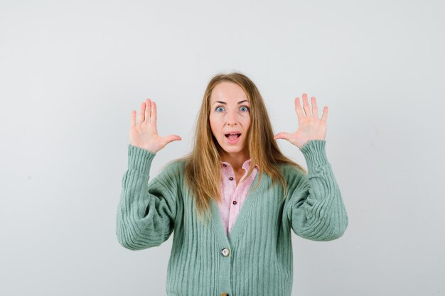 Expressive young woman posing in the studio