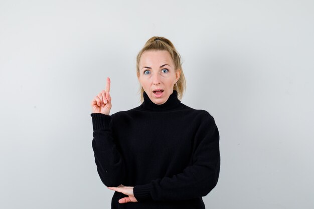 Expressive young woman posing in the studio