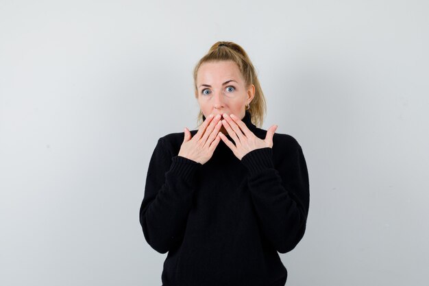 Expressive young woman posing in the studio