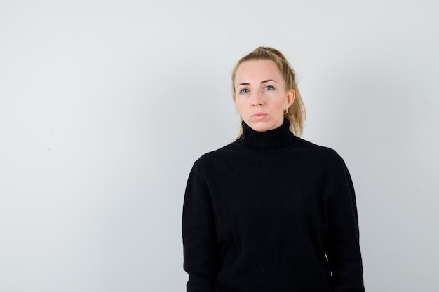 Expressive young woman posing in the studio