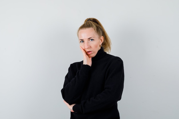 Expressive young woman posing in the studio