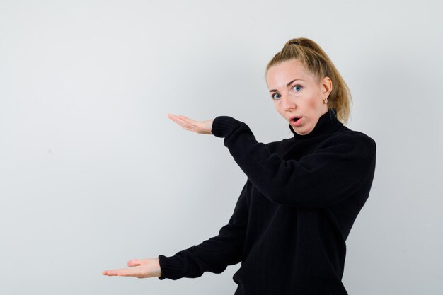 Expressive young woman posing in the studio