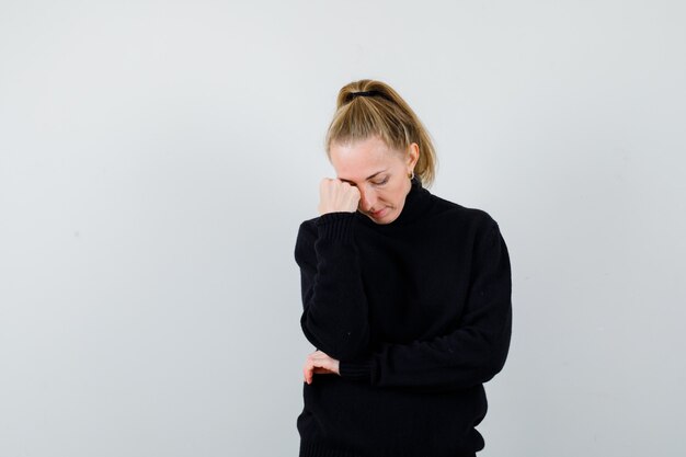 Expressive young woman posing in the studio