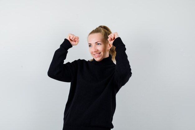 Expressive young woman posing in the studio