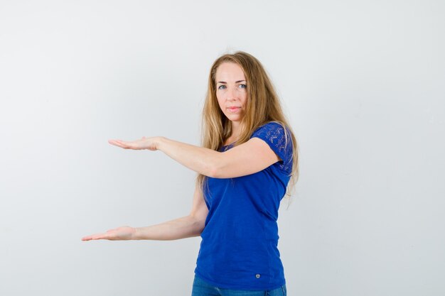 Expressive young woman posing in the studio