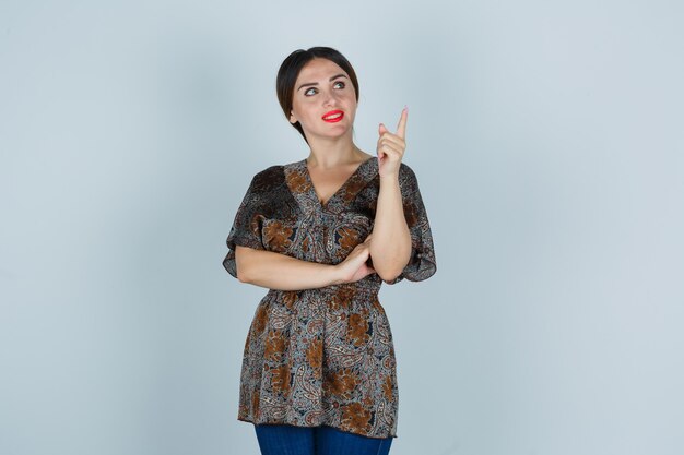 Expressive young woman posing in the studio