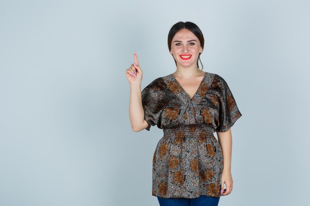 Expressive young woman posing in the studio