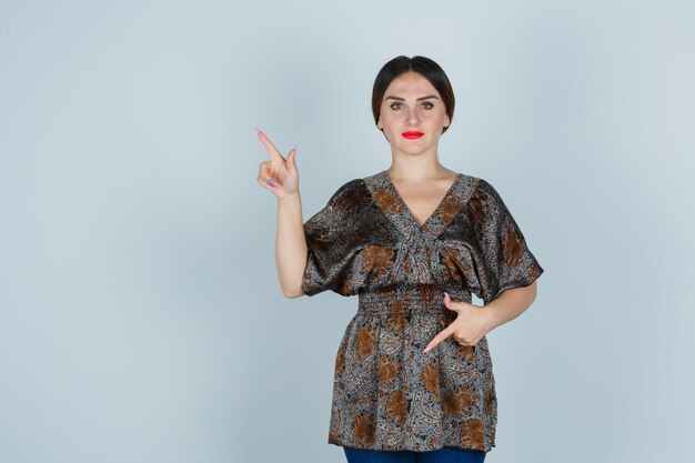 Expressive young woman posing in the studio