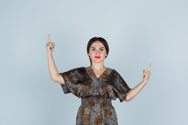 Expressive young woman posing in the studio