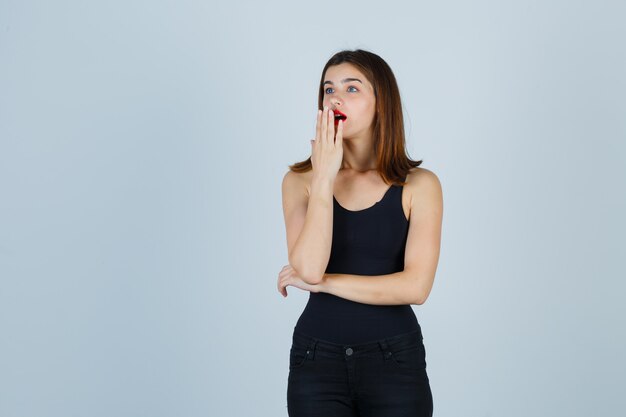 Expressive young woman posing in the studio