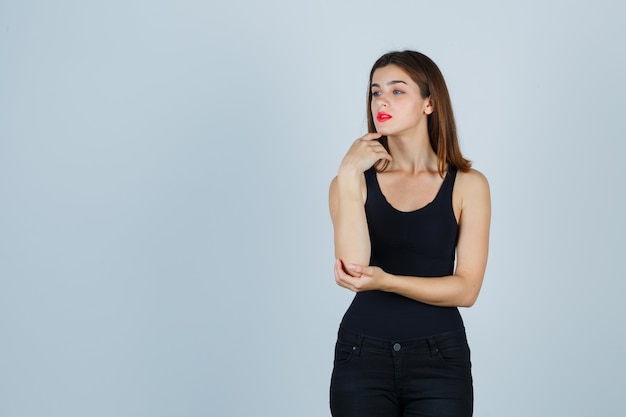 Expressive young woman posing in the studio