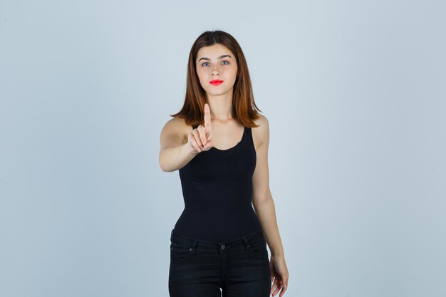 Expressive young woman posing in the studio