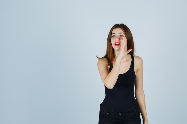 Expressive young woman posing in the studio