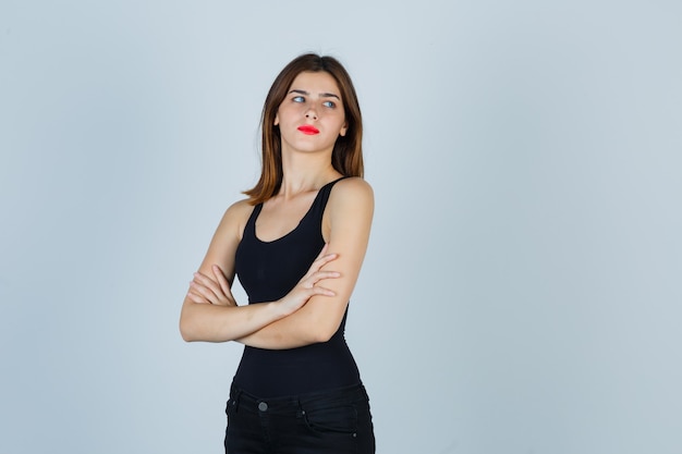 Expressive young woman posing in the studio