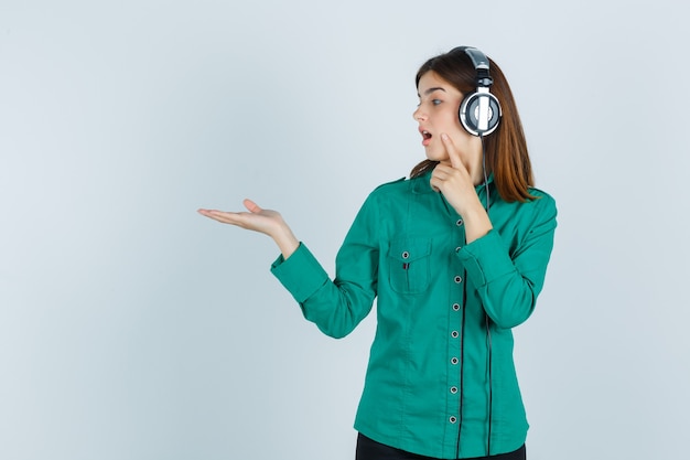 Expressive young woman posing in the studio