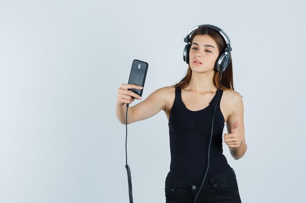 Expressive young woman posing in the studio