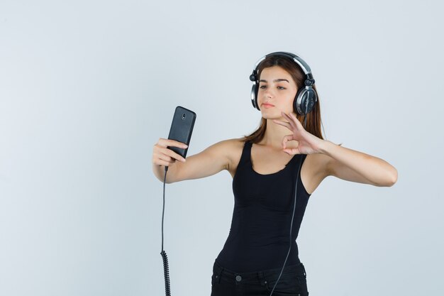 Expressive young woman posing in the studio