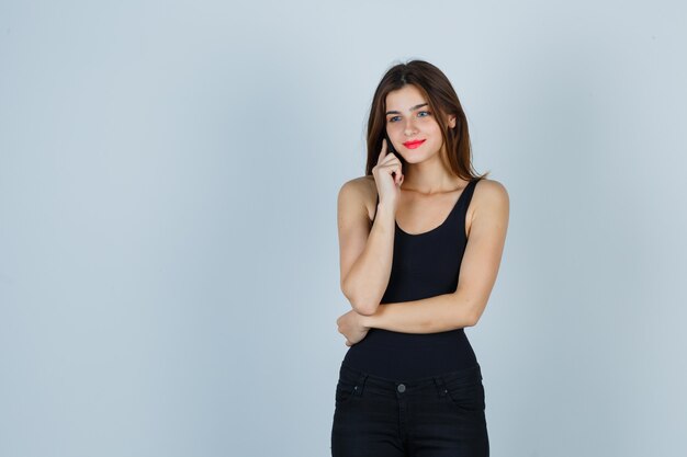 Expressive young woman posing in the studio