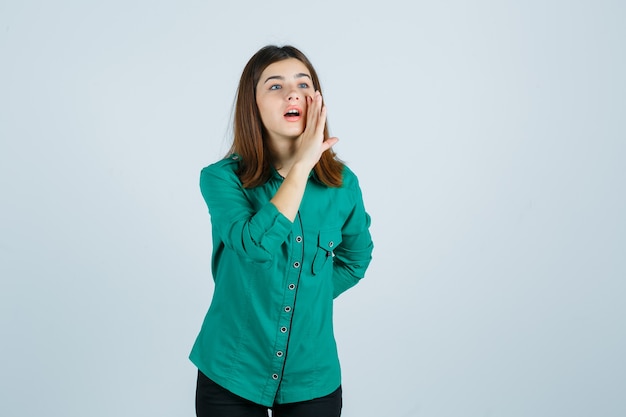 Expressive young woman posing in the studio