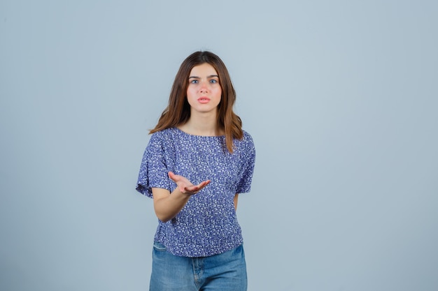 Expressive young woman posing in the studio