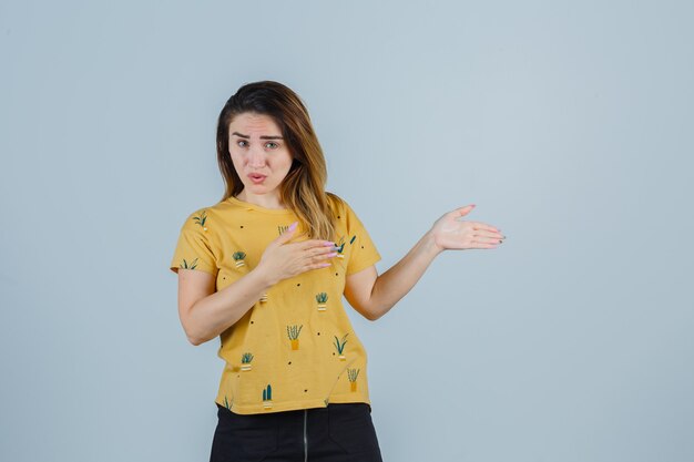 Expressive young woman posing in the studio