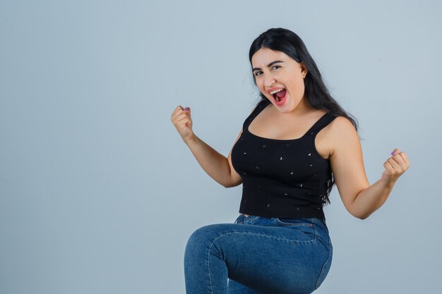 Expressive young woman posing in the studio