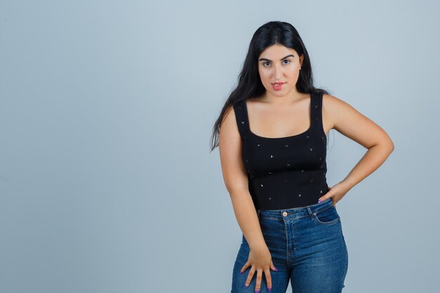 Expressive young woman posing in the studio