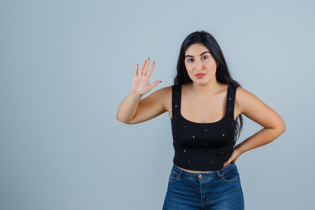 Expressive young woman posing in the studio