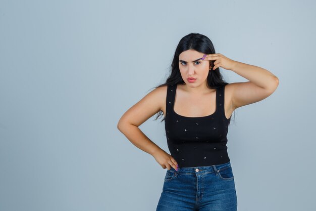 Expressive young woman posing in the studio