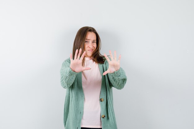 Expressive young woman posing in the studio