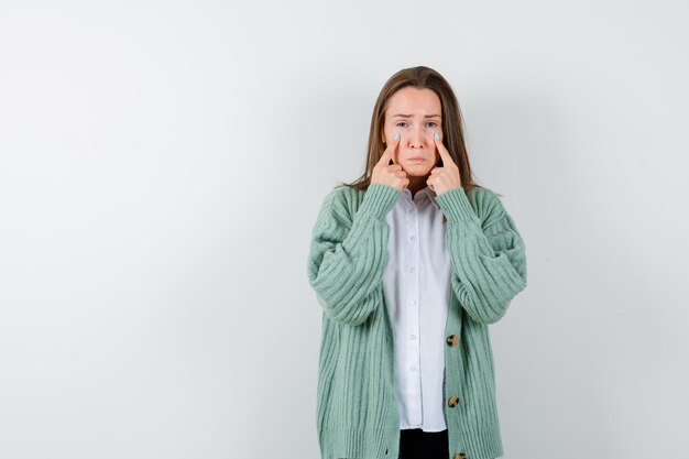 Expressive young woman posing in the studio