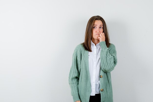 Expressive young woman posing in the studio