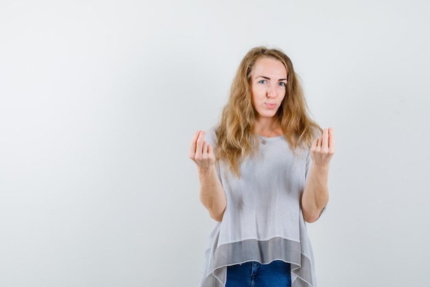 Expressive young woman posing in the studio