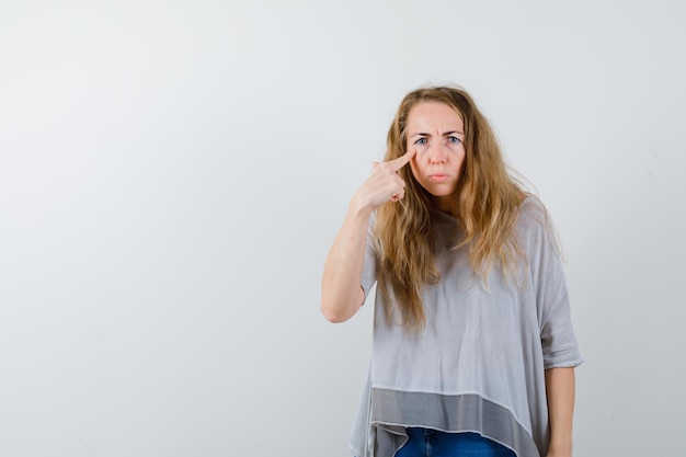 Expressive young woman posing in the studio