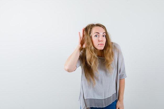 Expressive young woman posing in the studio