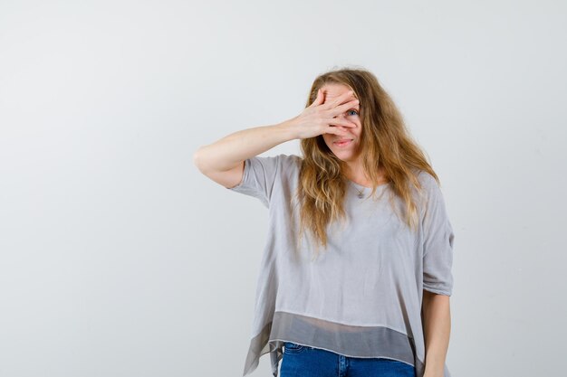 Expressive young woman posing in the studio