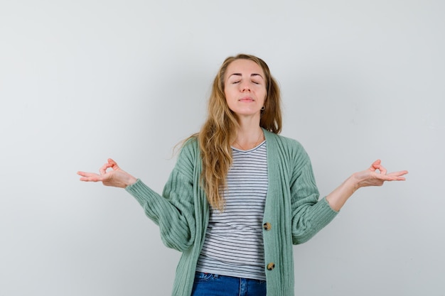 Expressive young woman posing in the studio