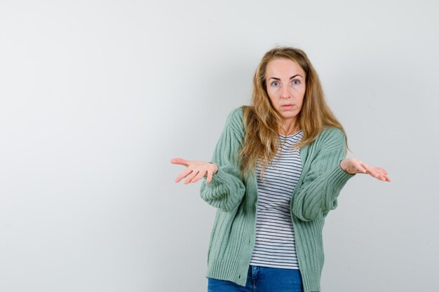 Expressive young woman posing in the studio