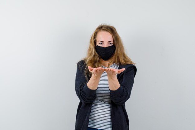 Expressive young woman posing in the studio